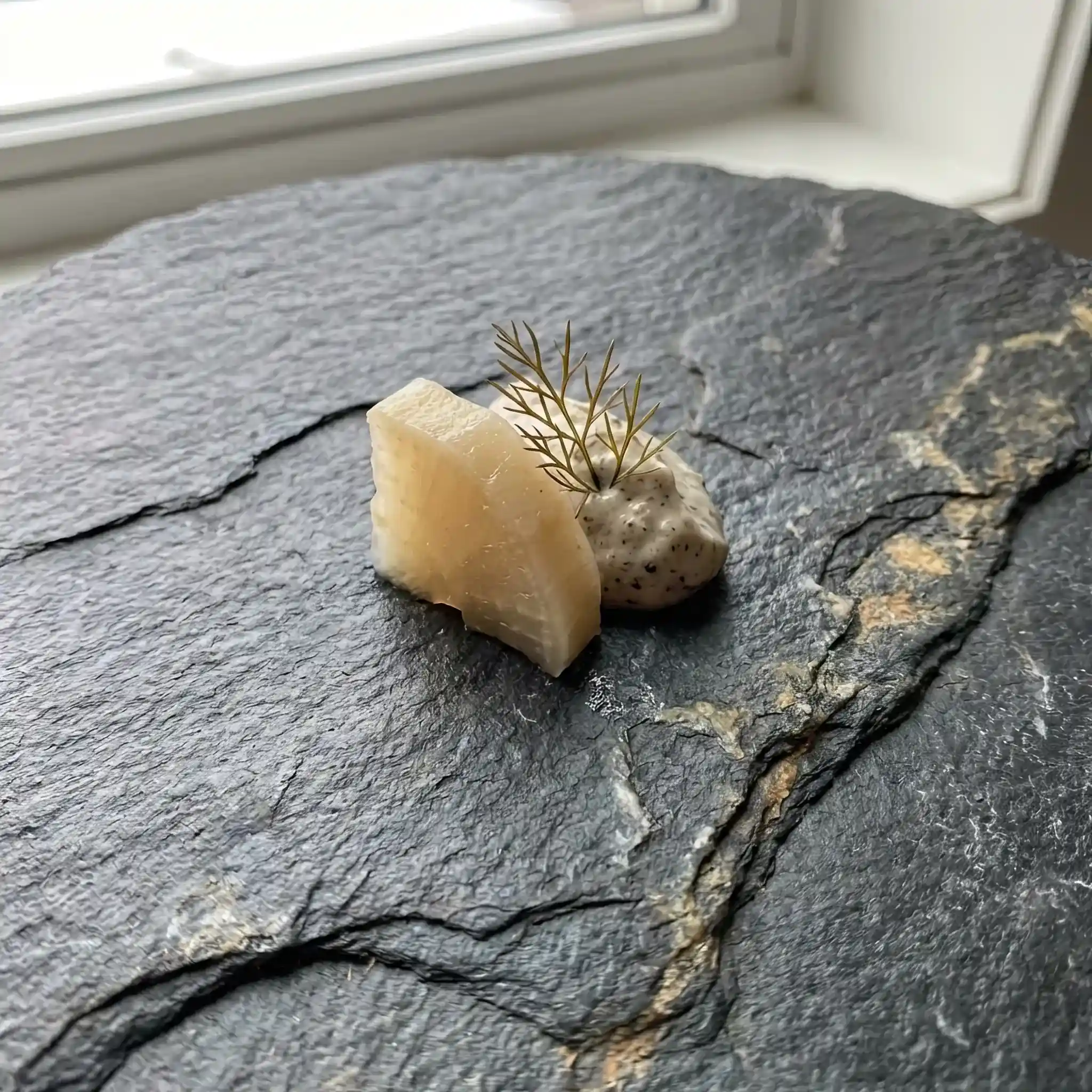 Interior detail: A robotic arm creating complex gastronomic compositions in a lobby