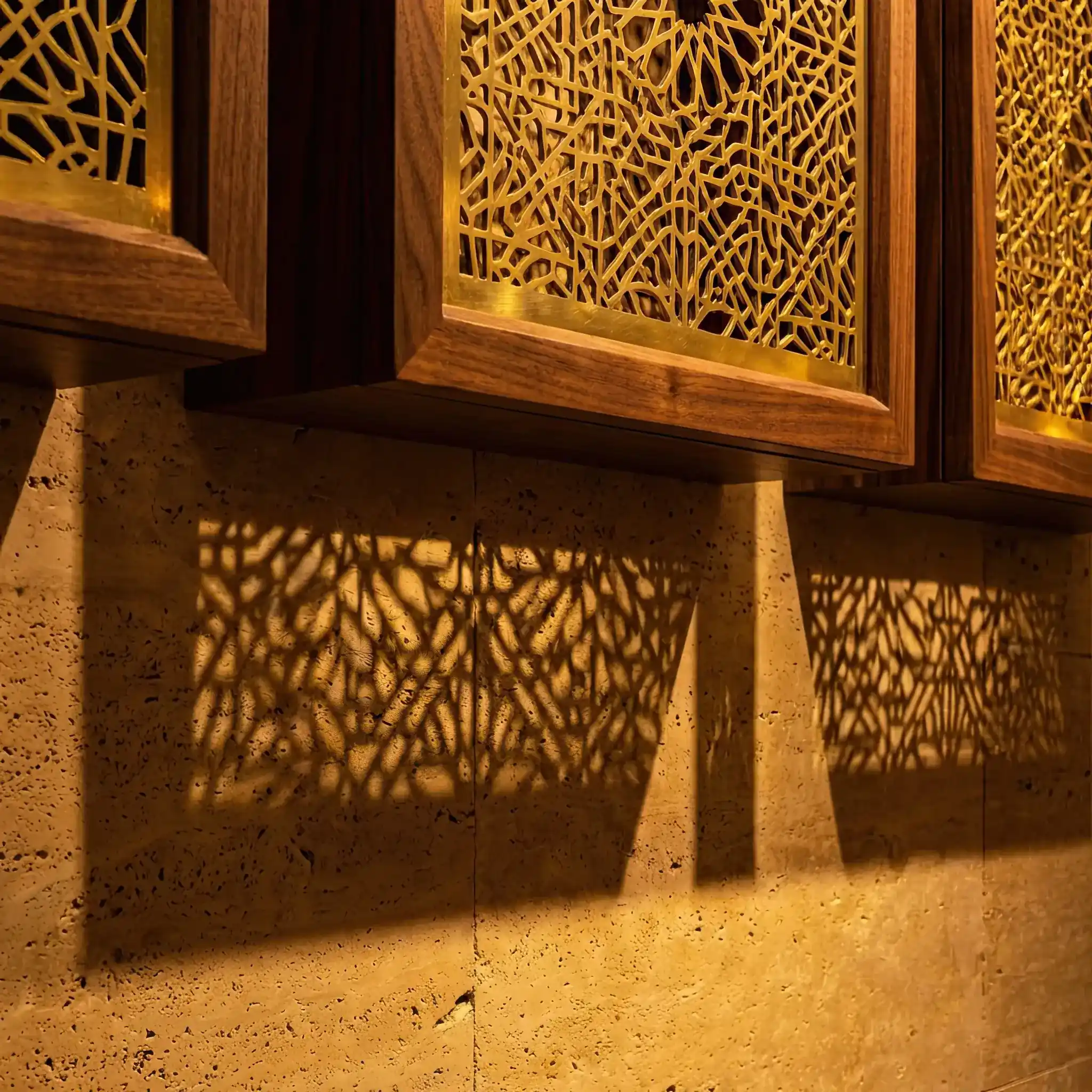 Interior detail: A sculpture creating a complex shadow projection on a lobby wall