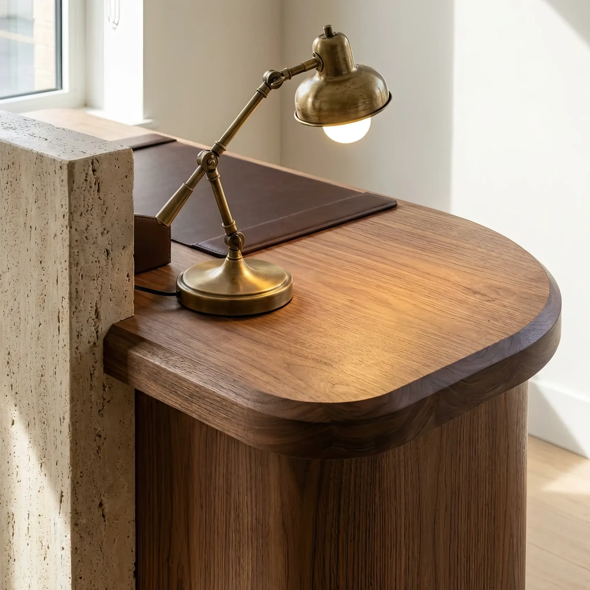 Interior detail: Reception desk with a thin layer of water flowing down a textured stone facade